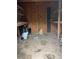 Rustic shed interior featuring wood paneling and shelving at 108 Virgil Rd, Durham, NC 27703