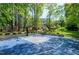 Enjoy the outdoor basketball court, perfect for recreation and sports, surrounded by lush trees and greenery at 111 Finnway Ln, Cary, NC 27519