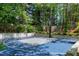 Outdoor basketball court surrounded by mature trees and green landscaping, perfect for recreation at 111 Finnway Ln, Cary, NC 27519