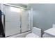 Bathroom featuring a frosted glass shower and low-flow toilet and sink at 111 Finnway Ln, Cary, NC 27519