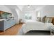 Spacious bedroom with tray ceilings, hardwood floors, and plenty of natural light at 111 Finnway Ln, Cary, NC 27519