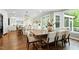 Open dining area with hardwood floors, modern lighting, and backyard views at 111 Finnway Ln, Cary, NC 27519