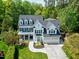 A beautiful two-story home with a manicured lawn, dormer windows, and a two-car garage at 111 Finnway Ln, Cary, NC 27519