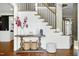 Inviting foyer features classic millwork, hardwood floors, and staircase at 111 Finnway Ln, Cary, NC 27519