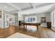 Spacious game room with pool table, ample lighting, and access to the outdoor patio at 111 Finnway Ln, Cary, NC 27519