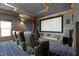 Home theater showcasing comfortable seating, a large projection screen, and surround sound system for entertainment at 111 Finnway Ln, Cary, NC 27519