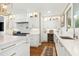 Gourmet kitchen with stainless steel appliances, quartz countertops, and ample storage at 111 Finnway Ln, Cary, NC 27519
