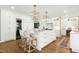 Island kitchen features stainless appliances, pendant lighting, and bar seating at 111 Finnway Ln, Cary, NC 27519