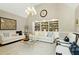 Cozy living room with vaulted ceilings, built-in shelving, and natural light at 111 Finnway Ln, Cary, NC 27519