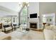 Bright living room with vaulted ceilings, fireplace, and large windows at 111 Finnway Ln, Cary, NC 27519