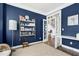 Stylish home office with built-in shelving and sophisticated blue walls at 111 Finnway Ln, Cary, NC 27519