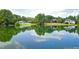 Picturesque pond reflecting nearby homes and trees on a clear day at 111 Finnway Ln, Cary, NC 27519