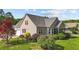 Home featuring a screened porch, fenced yard, mature trees and garden at 1141 Contender Dr, Clayton, NC 27520