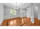 Open living area featuring hardwood floors, ample natural light, and modern architectural details at 1141 Contender Dr, Clayton, NC 27520