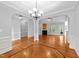 Spacious living area with hardwood floors, fireplace, and modern chandelier lighting at 1141 Contender Dr, Clayton, NC 27520