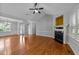 Spacious living room features a fireplace, wood floors, and plenty of natural light at 1141 Contender Dr, Clayton, NC 27520