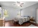 Calming bedroom with two windows providing natural light and a ceiling fan at 115 Mill Run Ln, Sanford, NC 27330