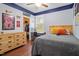 This bedroom features hardwood floors, ceiling fan, and a walk-in closet at 115 Mill Run Ln, Sanford, NC 27330