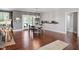 Spacious dining area features hardwood floors, a round table, and access to the outdoors at 115 Mill Run Ln, Sanford, NC 27330
