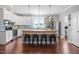 Charming kitchen with white cabinets, a spacious island, and stainless steel appliances at 115 Mill Run Ln, Sanford, NC 27330