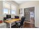 Bright home office with large windows, hardwood floors, and a view into the bedroom at 115 Mill Run Ln, Sanford, NC 27330