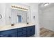 Bathroom features a dual sink vanity with ample lighting, perfect for busy mornings at 1156 Darius Pearce Rd, Youngsville, NC 27596