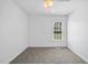 Bedroom boasts neutral carpet, fresh paint, and a window offering natural light at 1156 Darius Pearce Rd, Youngsville, NC 27596