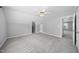 Neutral bedroom features carpet, ceiling fan, and access to additional spaces at 1156 Darius Pearce Rd, Youngsville, NC 27596