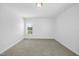 Bedroom features neutral carpet, fresh paint, window offering natural light at 1156 Darius Pearce Rd, Youngsville, NC 27596