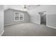 Spacious bedroom has neutral carpeting, a ceiling fan, and a large window for natural light at 1156 Darius Pearce Rd, Youngsville, NC 27596