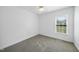 Bedroom boasts neutral carpet, fresh paint, and a window offering natural light at 1156 Darius Pearce Rd, Youngsville, NC 27596
