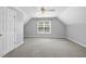 Neutral bedroom with ceiling fan and ample light from a large window at 1156 Darius Pearce Rd, Youngsville, NC 27596