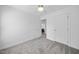 Bedroom boasts neutral carpet, fresh paint, and an open doorway at 1156 Darius Pearce Rd, Youngsville, NC 27596