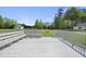 Inviting outdoor deck with ample seating, perfect for relaxing and enjoying the surrounding natural views at 1156 Darius Pearce Rd, Youngsville, NC 27596