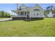 Beautiful home with a classic design, featuring a welcoming porch, and neatly maintained landscaping at 1156 Darius Pearce Rd, Youngsville, NC 27596