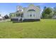 Classic home with bay window, covered porch, and pristine lawn, ideal for gracious living at 1156 Darius Pearce Rd, Youngsville, NC 27596