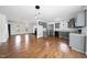 Open floorplan features hardwood floors, the kitchen, and the fireplace, making it perfect for entertaining and Gathering time at 1156 Darius Pearce Rd, Youngsville, NC 27596