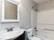 Bathroom featuring tub and shower combination, toilet and sink with mirror cabinet at 116 Old Maple Ln, Durham, NC 27713