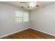 Bedroom showcases hardwood floors and a window for natural light at 116 Old Maple Ln, Durham, NC 27713