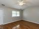 Spacious bedroom with ceiling fan, closet and large window at 116 Old Maple Ln, Durham, NC 27713
