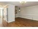 The living room has hardwood floors, white trim, and ample lighting at 116 Old Maple Ln, Durham, NC 27713