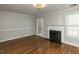 Bright living room with hardwood floors and fireplace; an open and inviting space at 116 Old Maple Ln, Durham, NC 27713