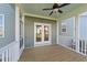 Cozy screened-in back porch with wooden floors and a ceiling fan provides an inviting outdoor retreat at 1245 Porters Call Dr, Wendell, NC 27591
