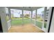 Covered back porch featuring screened walls and outdoor views, ideal for relaxation and enjoying the backyard at 1245 Porters Call Dr, Wendell, NC 27591