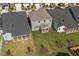 An aerial view of a backyard with a patio and green lawn at 1245 Porters Call Dr, Wendell, NC 27591