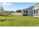 A beautiful backyard with lawn, landscaping, and covered patio at 1245 Porters Call Dr, Wendell, NC 27591