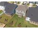 An aerial view of home with a large backyard, patio, and green lawn at 1245 Porters Call Dr, Wendell, NC 27591