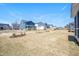 Expansive backyard with newly planted grass and young landscaping, perfect for outdoor activities in a Gathering-friendly neighborhood at 1245 Porters Call Dr, Wendell, NC 27591