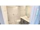 Modern bathroom featuring a glass-enclosed shower, granite vanity, and tile floors, offering a spa-like experience at 1245 Porters Call Dr, Wendell, NC 27591
