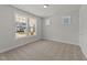 Bright bedroom with two windows and neutral carpet at 1245 Porters Call Dr, Wendell, NC 27591